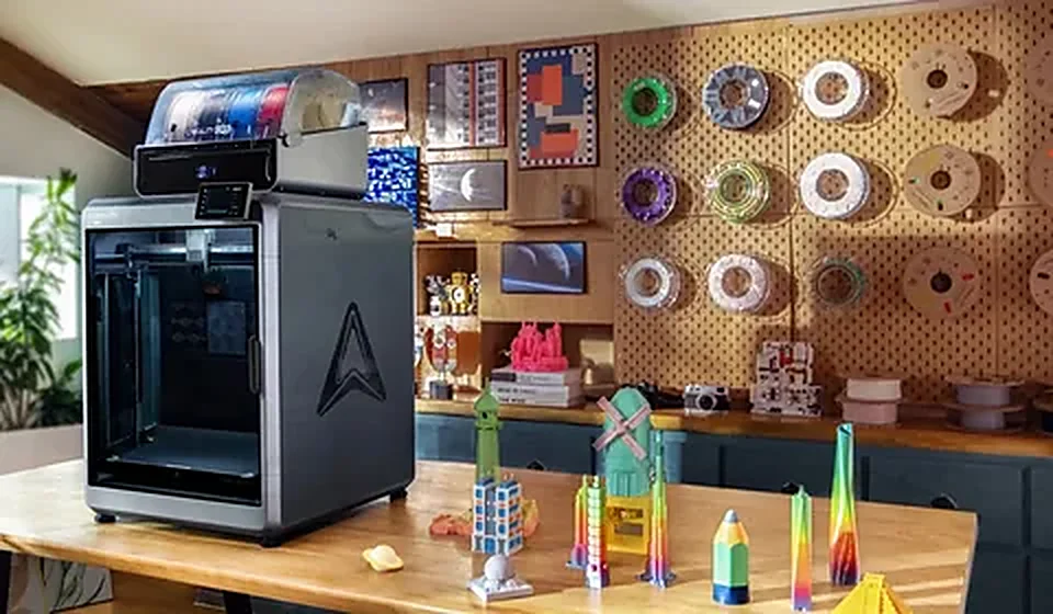 Workshop with 3D printer, filament spools and finished prints